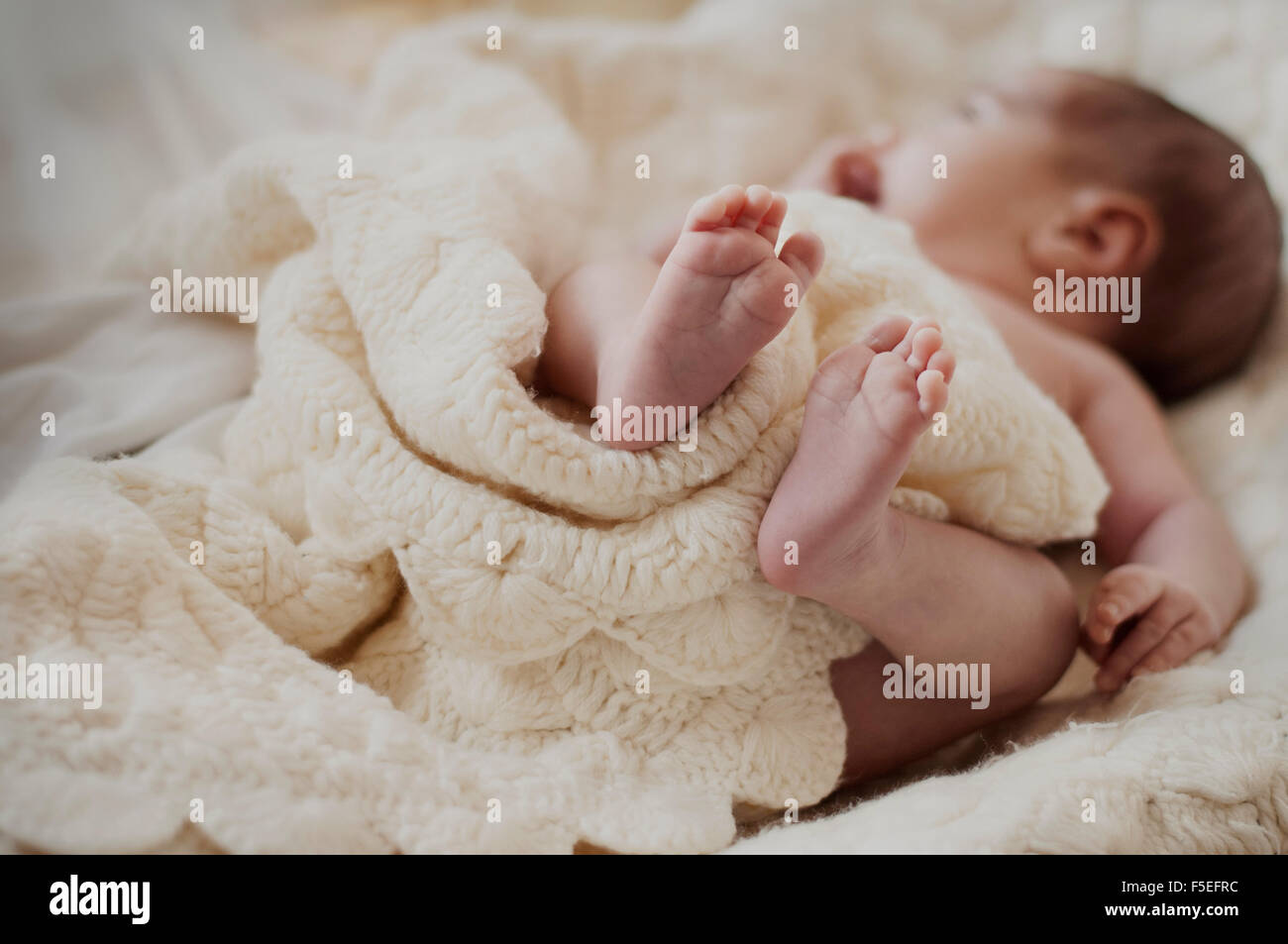 Sleeping newborn baby on bed hires stock photography and images Alamy