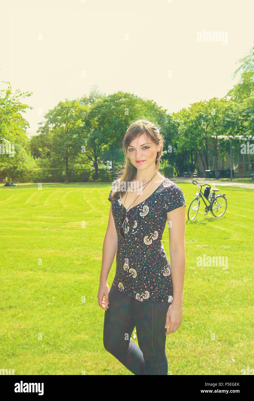 Woman standing outdoors in park hi-res stock photography and images - Alamy