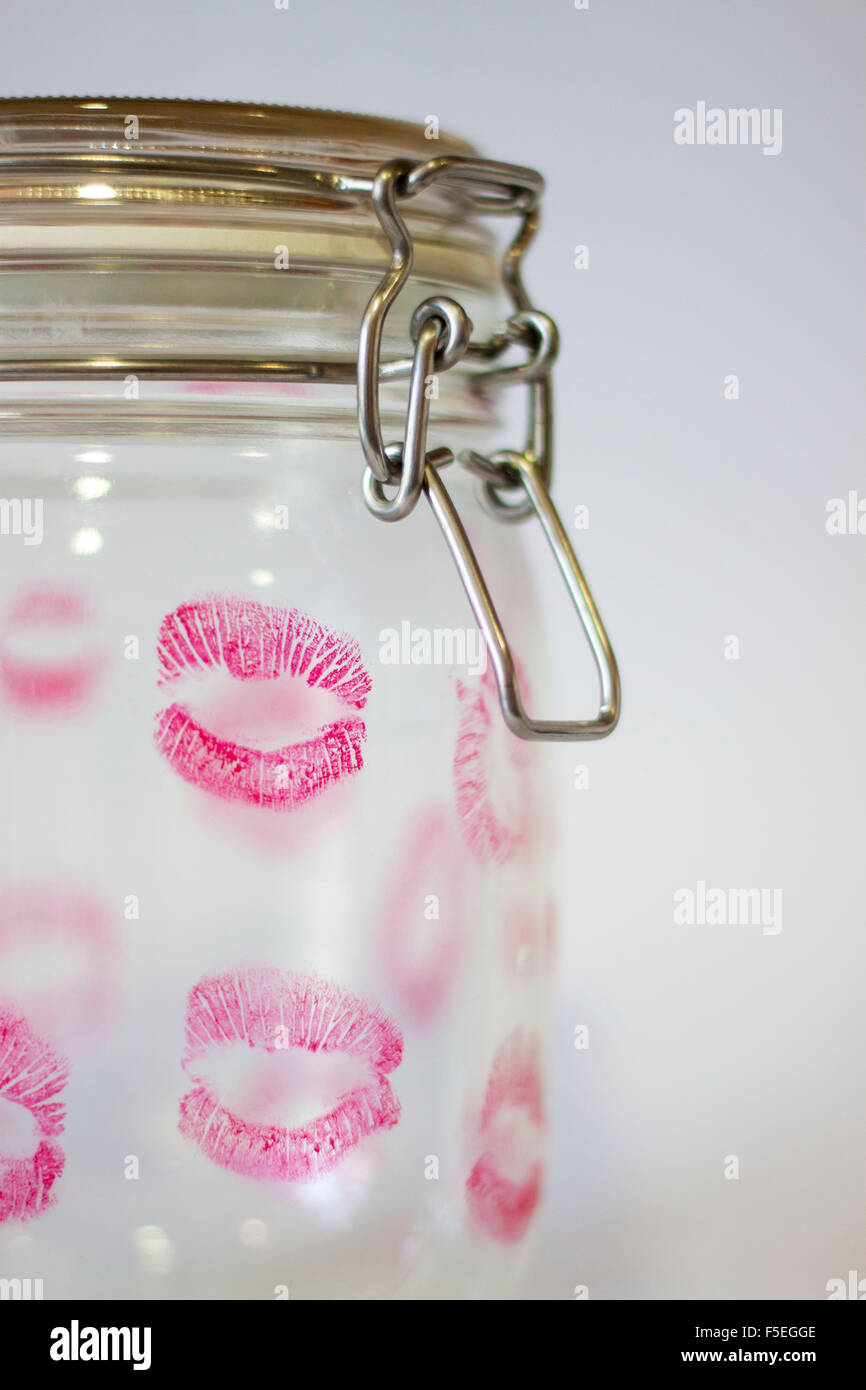Glass jar covered in lipstick kisses Stock Photo