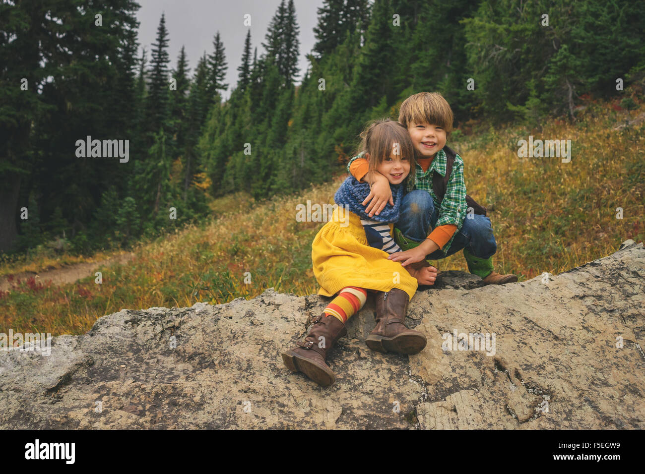 Smiling boy and girl hugging each other Stock Photo