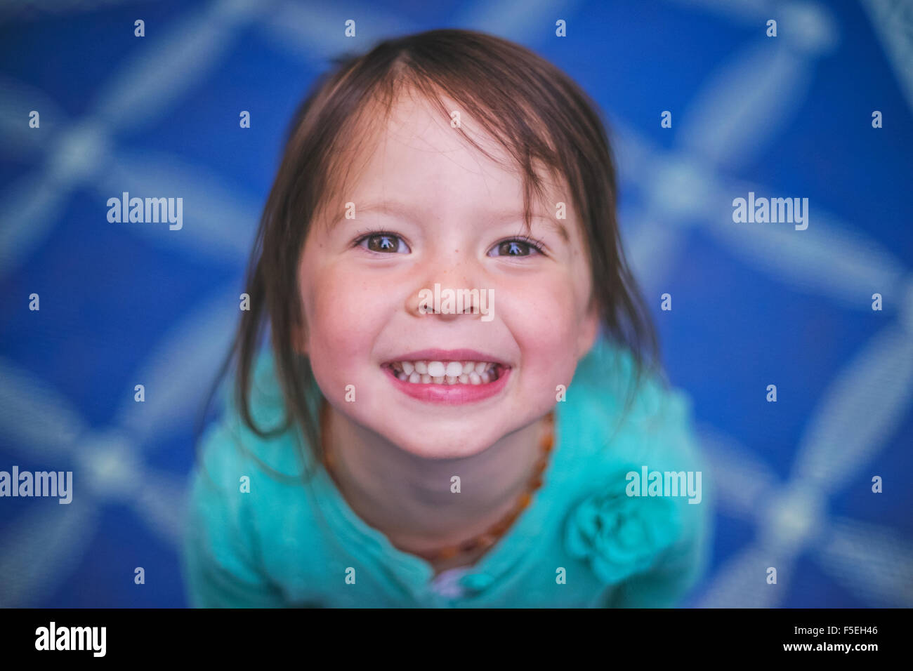 Portrait of a smiling girl looking up Stock Photo