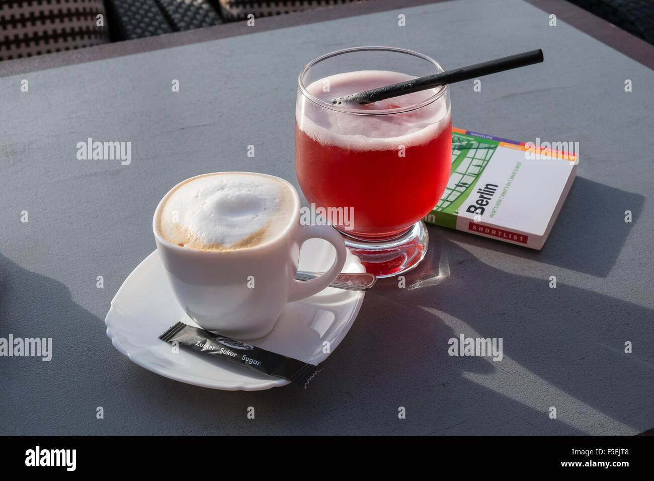 Cappuccino and red beer drinks, served in Berlin, Germany Stock Photo