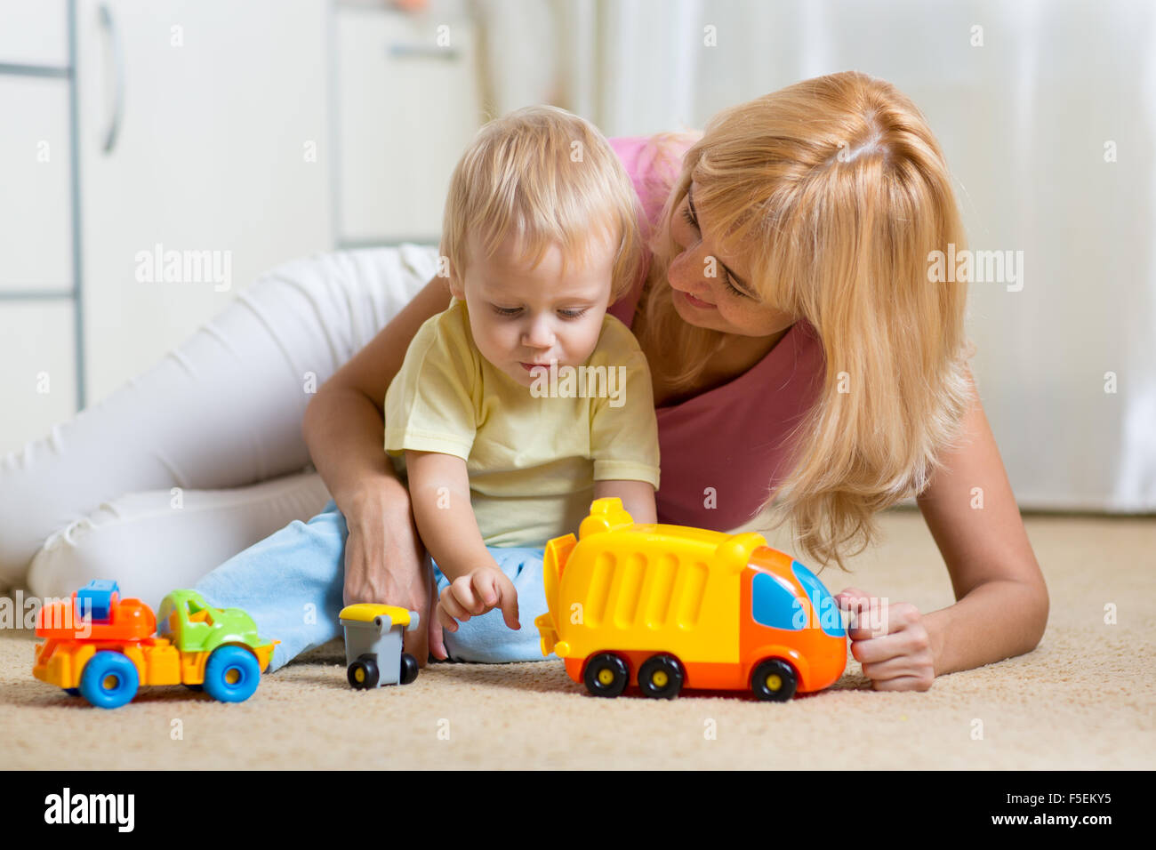 happy mother and child toddler boy playing together at home Stock Photo ...