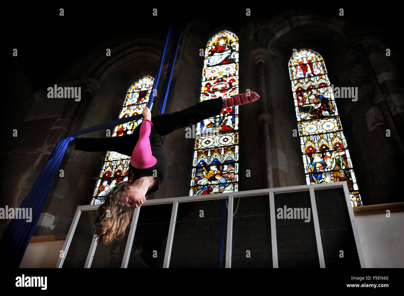 Hazel Maddocks has gone back to work as a trapeze and silk acrobat after giving birth to her baby Mea and she holds classes at the All Saints Centre in Lewes Stock Photo