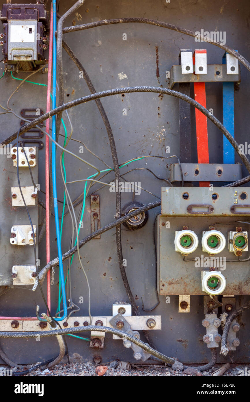 Old broken circuit breakers at a switchboard Stock Photo