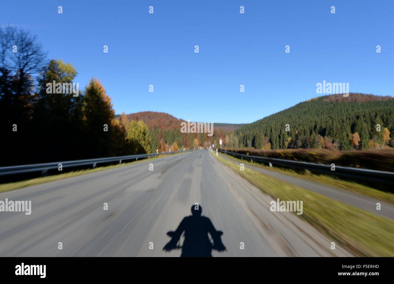 Motorcycle driver in autum, Germany, near city of Braunlage 2. November 2015. Photo: Frank May Stock Photo