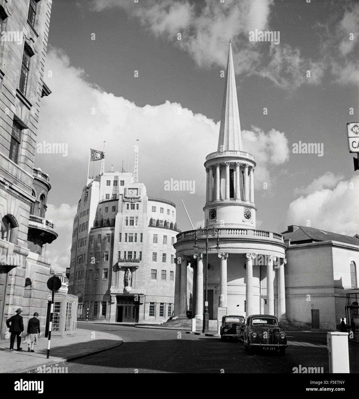 1950s historical, exterior of Broadcasting House, Marylebone, London, England, headquarters of the BBC and site of the first radio broadcast March 1932. Seen in the foreground is All Souls Church. Stock Photo