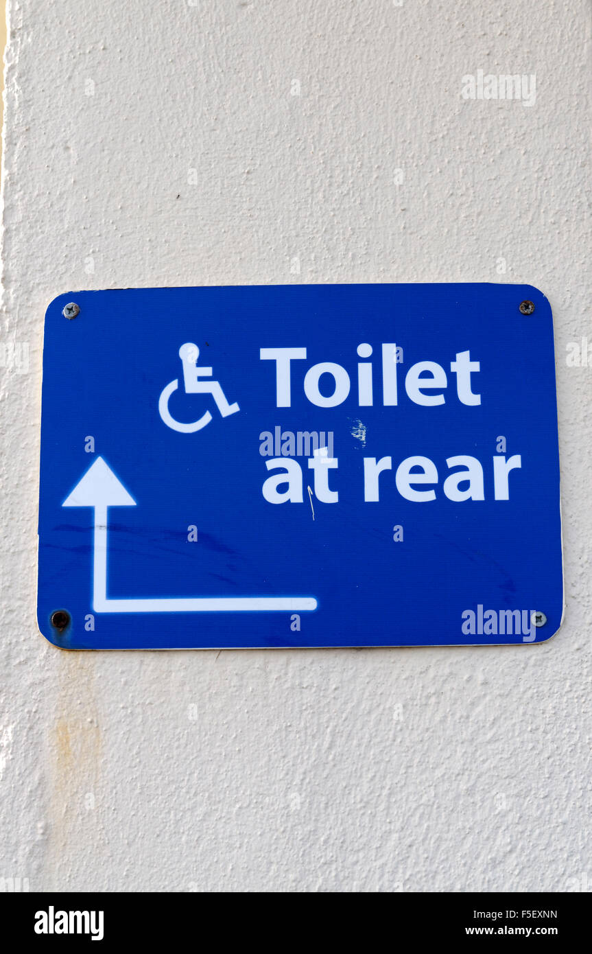 Disabled toilets at rear sign. Stock Photo