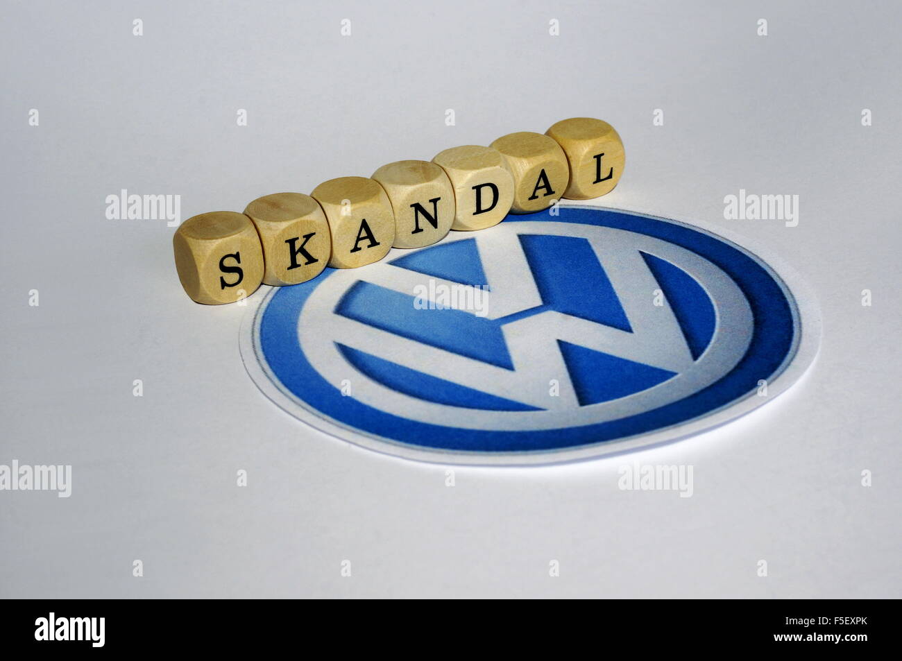 ILLUSTRATION - Cube letters that form the word 'scandal' next to the Volkswagen logo. The photo was taken on 15 October 2015. Photo: S. Steinach - NO WIRE SERVICE - Stock Photo