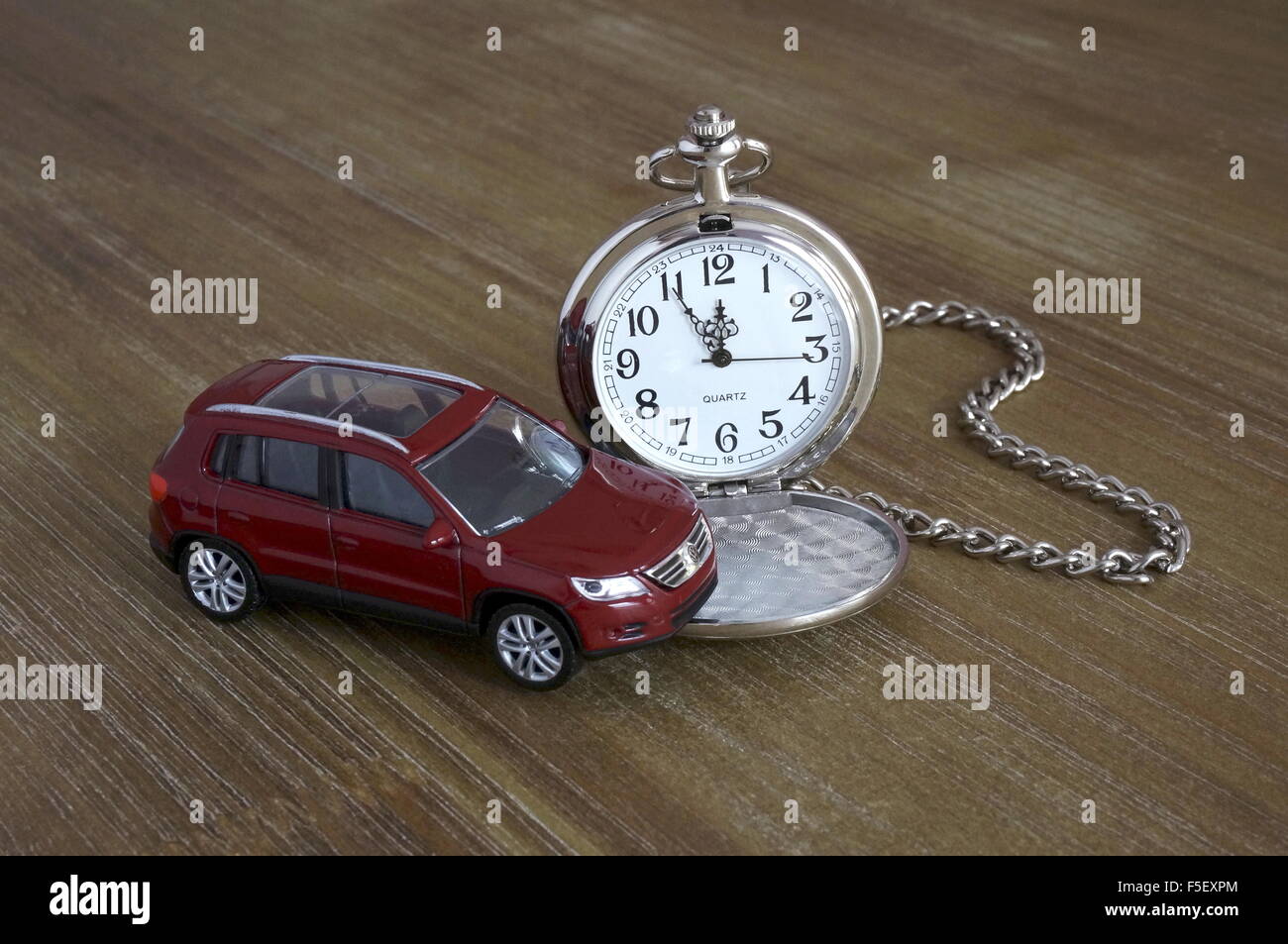 ILLUSTRATION - A Volkswagen car model 'VW Tiguan' next to a pocket watch. The photo was taken on 15 October 2015. Photo: S. Steinach - NO WIRE SERVICE - Stock Photo