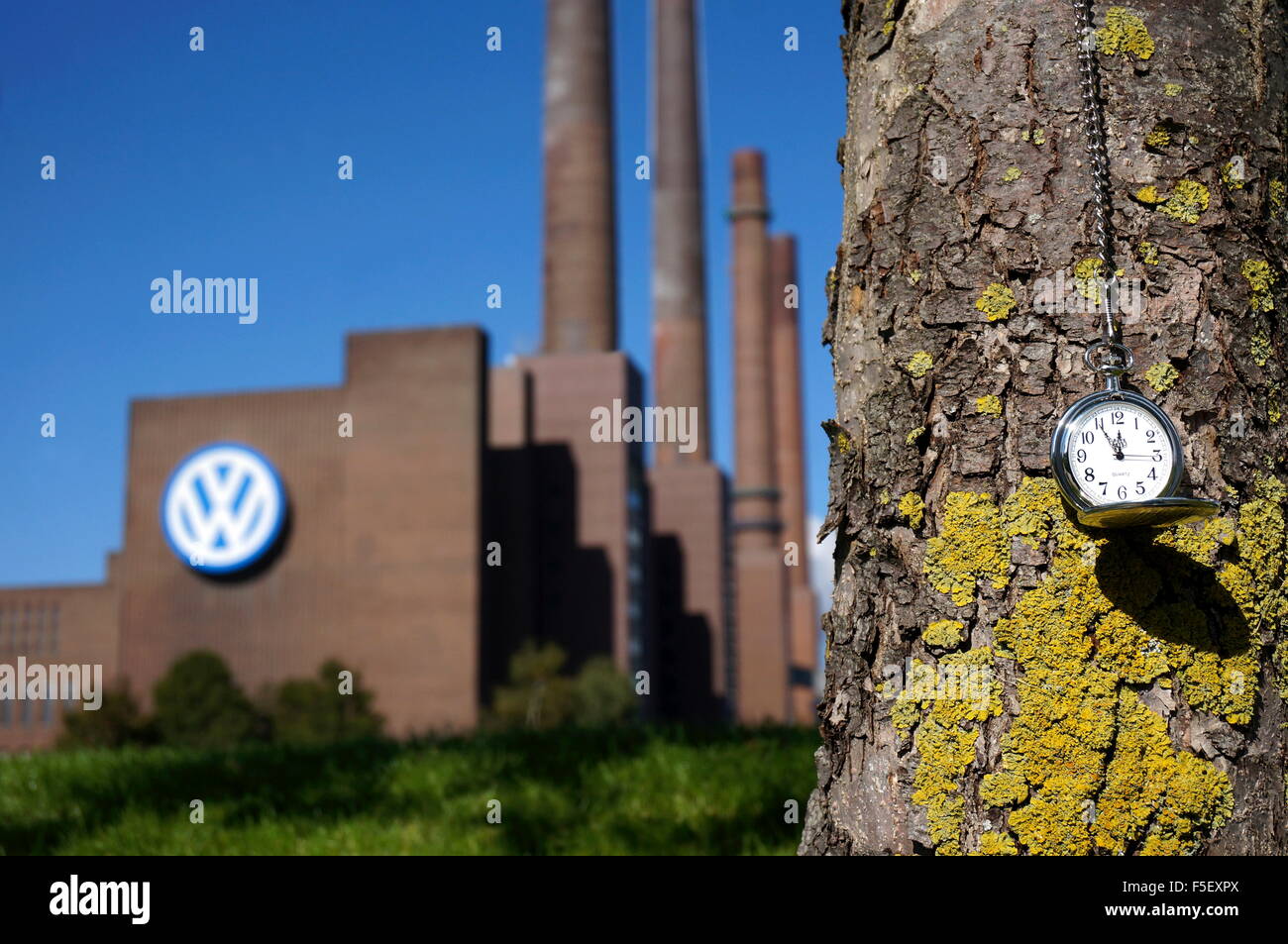 Illustration - A pocket watch in front of the Volkswagen factory in Wolfsburg. The time: Five to twelve. The photo was taken on 30 September 2015. Photo: S. Steinach - NO WIRE SERVICE – Stock Photo