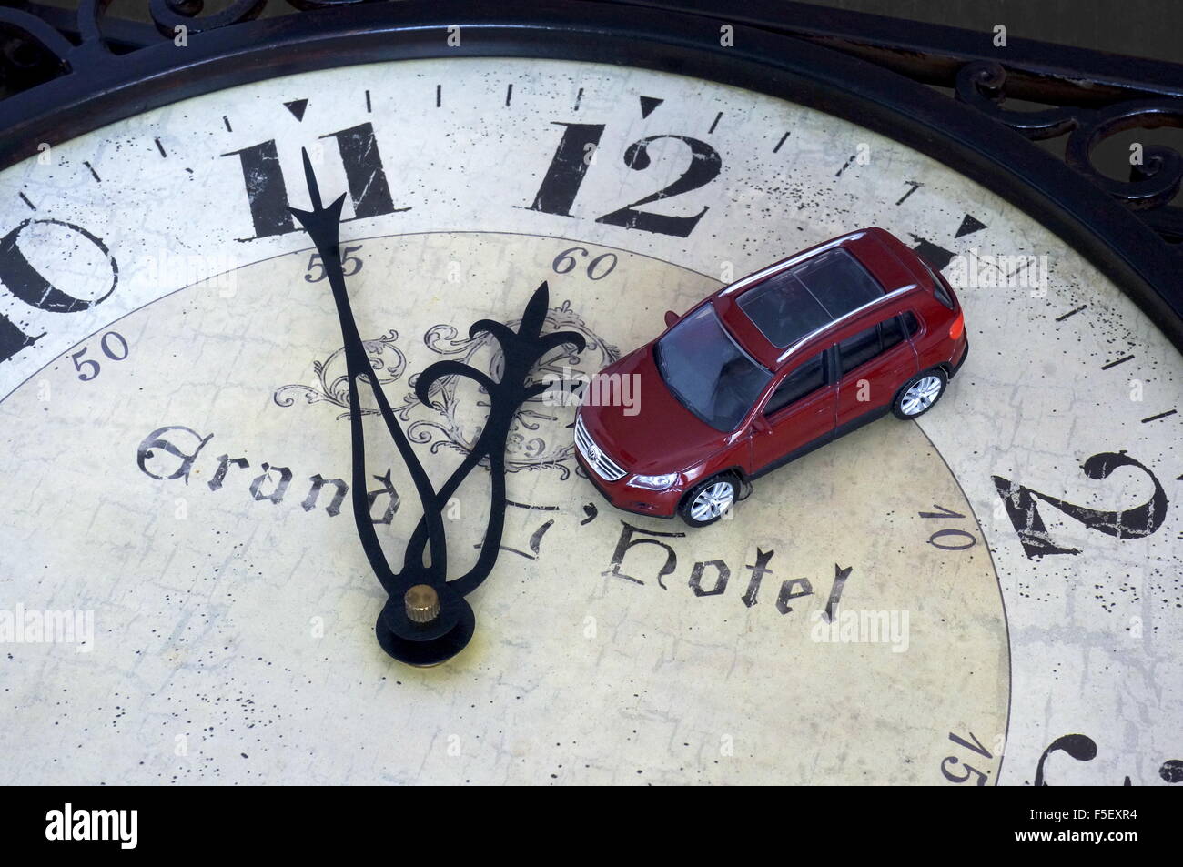 Illustration A Volkswagen car model 'VW Tiguan' on a clock where it