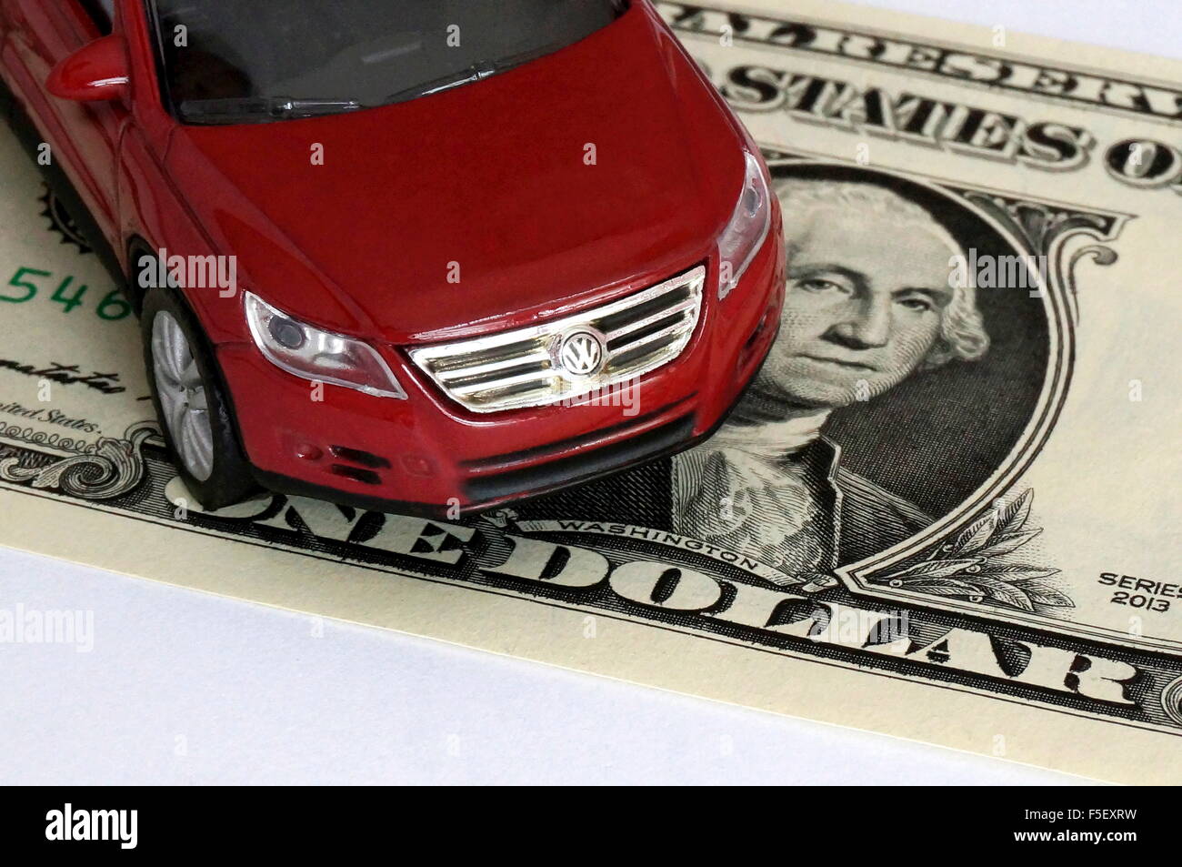ILLUSTRATION - A Volkswagen car model 'VW Tiguan' on a dollar bill. The photo was taken on 15 October 2015. Photo: S. Steinach - NO WIRE SERVICE - Stock Photo