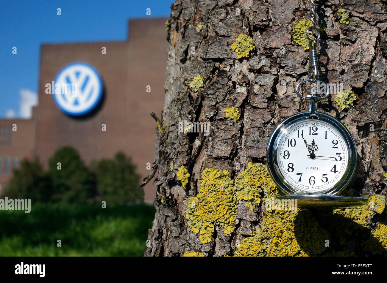 Illustration - A pocket watch in front of the Volkswagen factory in Wolfsburg. The time: Five to twelve. The photo was taken on 30 September 2015. Photo: S. Steinach - NO WIRE SERVICE - Stock Photo