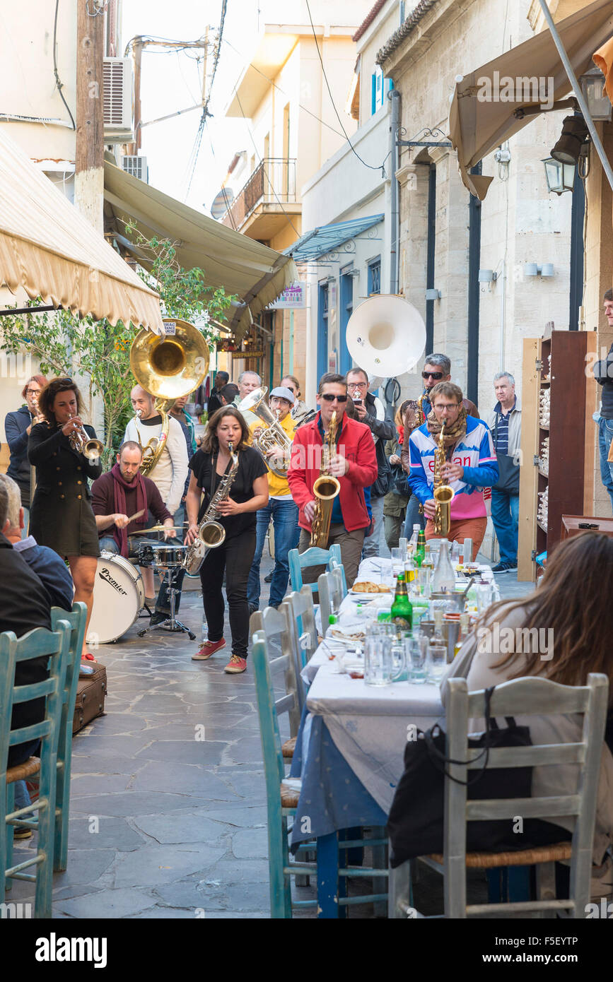 AEGINA, GREECE - OCTOBER 25, 2015: Band of musicians played on the terrace of a restaurant Stock Photo