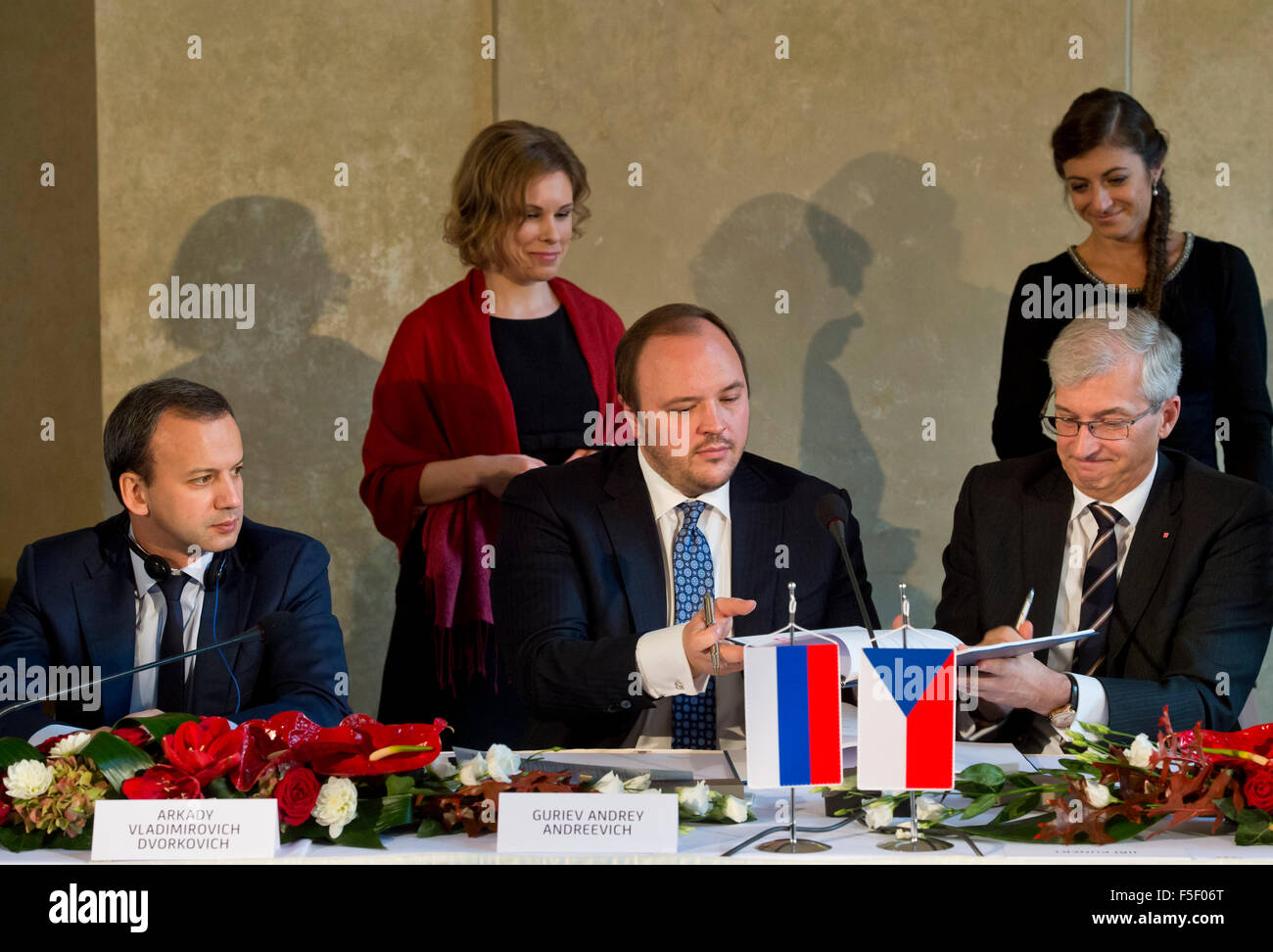 Prague, Czech Republic. 03rd Nov, 2015. Russia's deputy prime minister Arkady Dvorkovich (from left), CEO PhosAgro Andrey Guriev (Guryev) and CEO UniCredit Bank Czech Republic Jiri Kunert sign agreement on financing export of technology for fertiliser production worth Kc2bn in Prague, Czech Republic, November 3, 2015. Czech firm Chemoproject Nitrogen has acquired is the biggest business deal. Chemoproject Nitrogen will design and modernise a chemical plant for fertilisers production for Russian company PhosAgro in Cherepovets. Credit:  Vit Simanek/CTK Photo/Alamy Live News Stock Photo