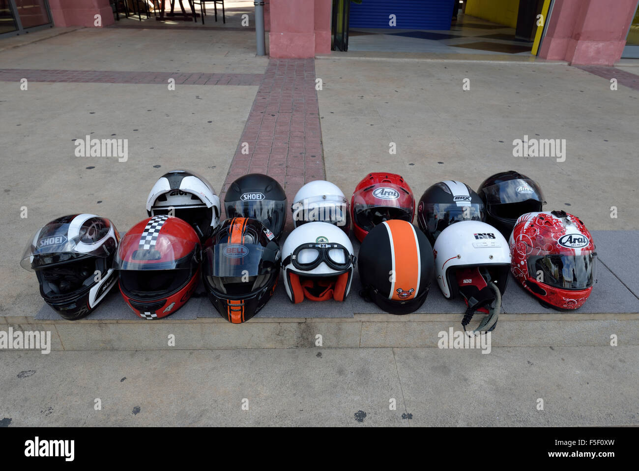 Motorcycle helmets lined up Stock Photo Alamy