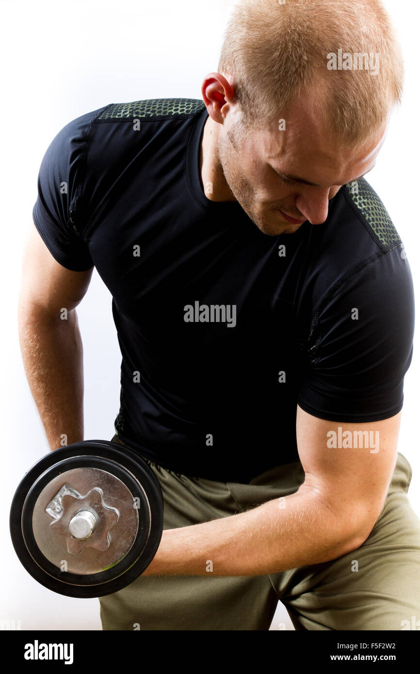 A young man curling a weight close to the camera Stock Photo
