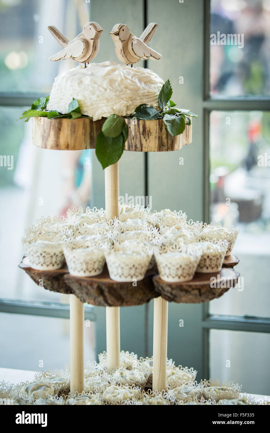 A decorative three tiered display of cupcakes Stock Photo
