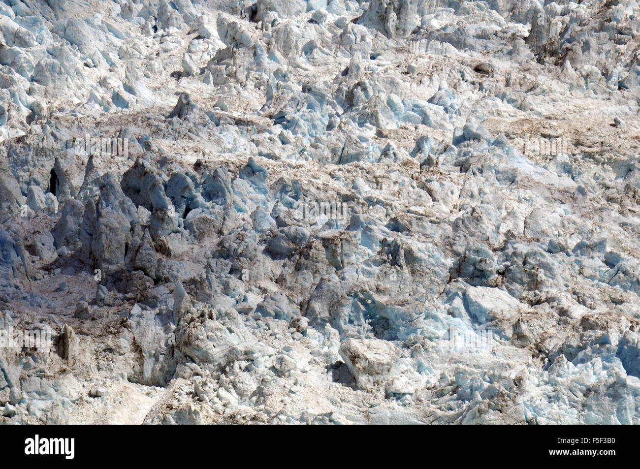 Ice blocks at Franz Josef Glacier, a glacier melting due to climate change, Franz Josef, South Island, New Zealand Stock Photo