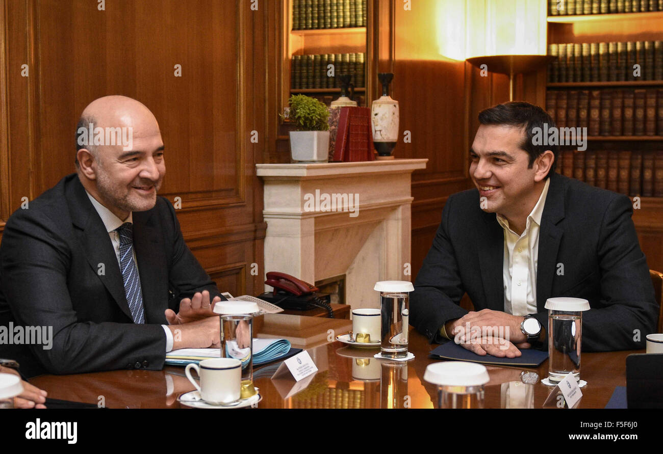 Athens, GREECE. 3rd Nov, 2015. Greek Prime Minister Alexis Tsipras, meets with European Commissioner for Economic and Financial Affairs Pierre Moscovici. Moscovici's talks with officials in Greece's leftwing government will focus on the progress of reforms demanded by the country's European creditors in return for a third multi-billion euro bailout. Credit:  Aristidis Vafeiadakis/ZUMA Wire/Alamy Live News Stock Photo