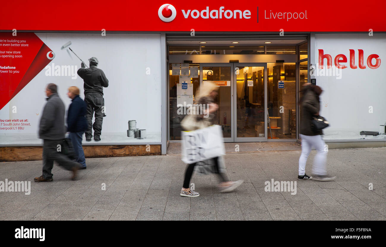 New Vodafone mobile telephone electronic communication store opening soon; Business being fitted out in Church Street, Liverpool One, Merseyside, UK. Stock Photo