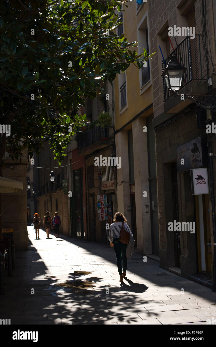 Narrow streets sunlit in the old quarter of Barcelona Catalonia Spain ES Stock Photo