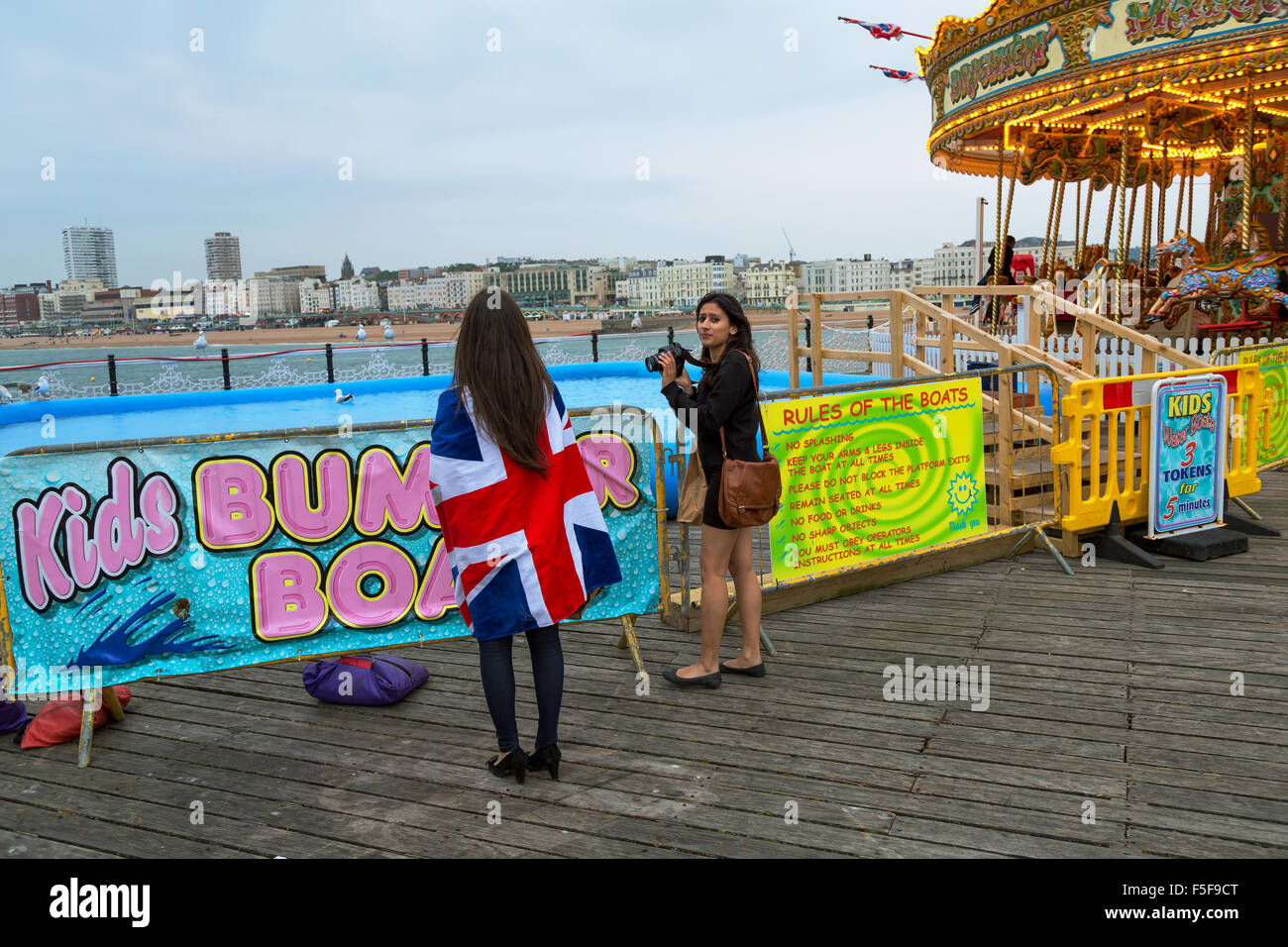 Brighton, United Kingdom, young women on the Brighton Pier Stock Photo