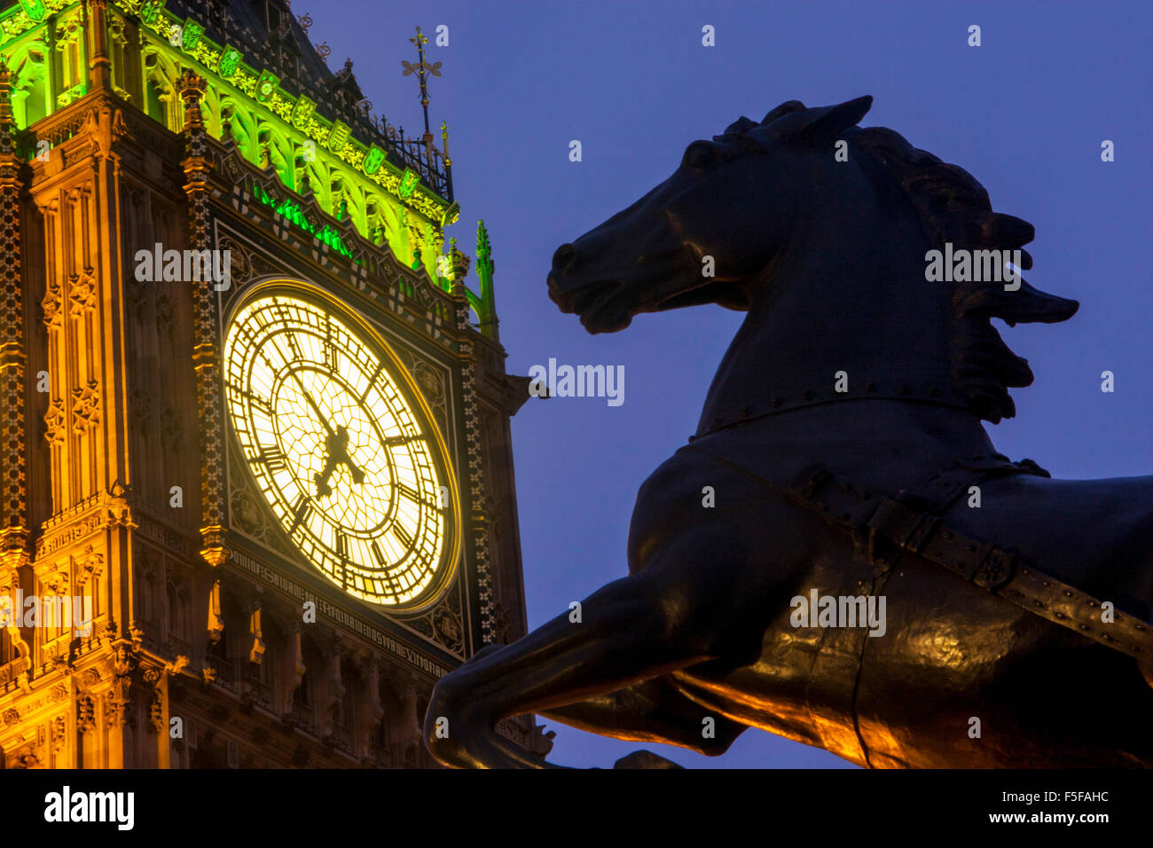 Big Ben and Boadicea horse statue at night twilight dusk Elizabeth Tower Houses of Parliament Westminster London England UK Stock Photo