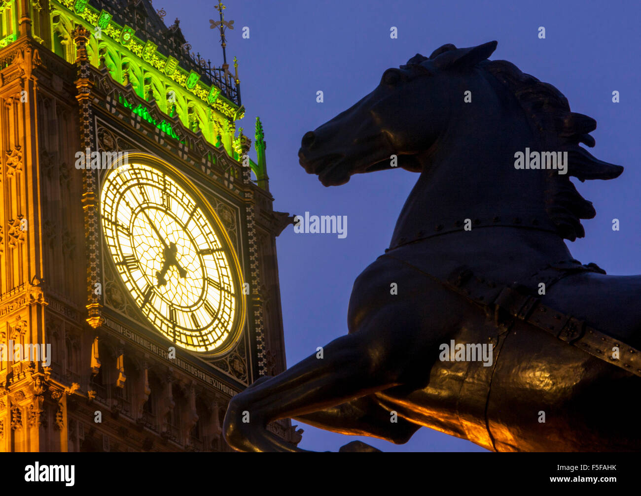 Big Ben and Boadicea horse statue at night twilight dusk Elizabeth Tower Houses of Parliament Westminster London England UK Stock Photo