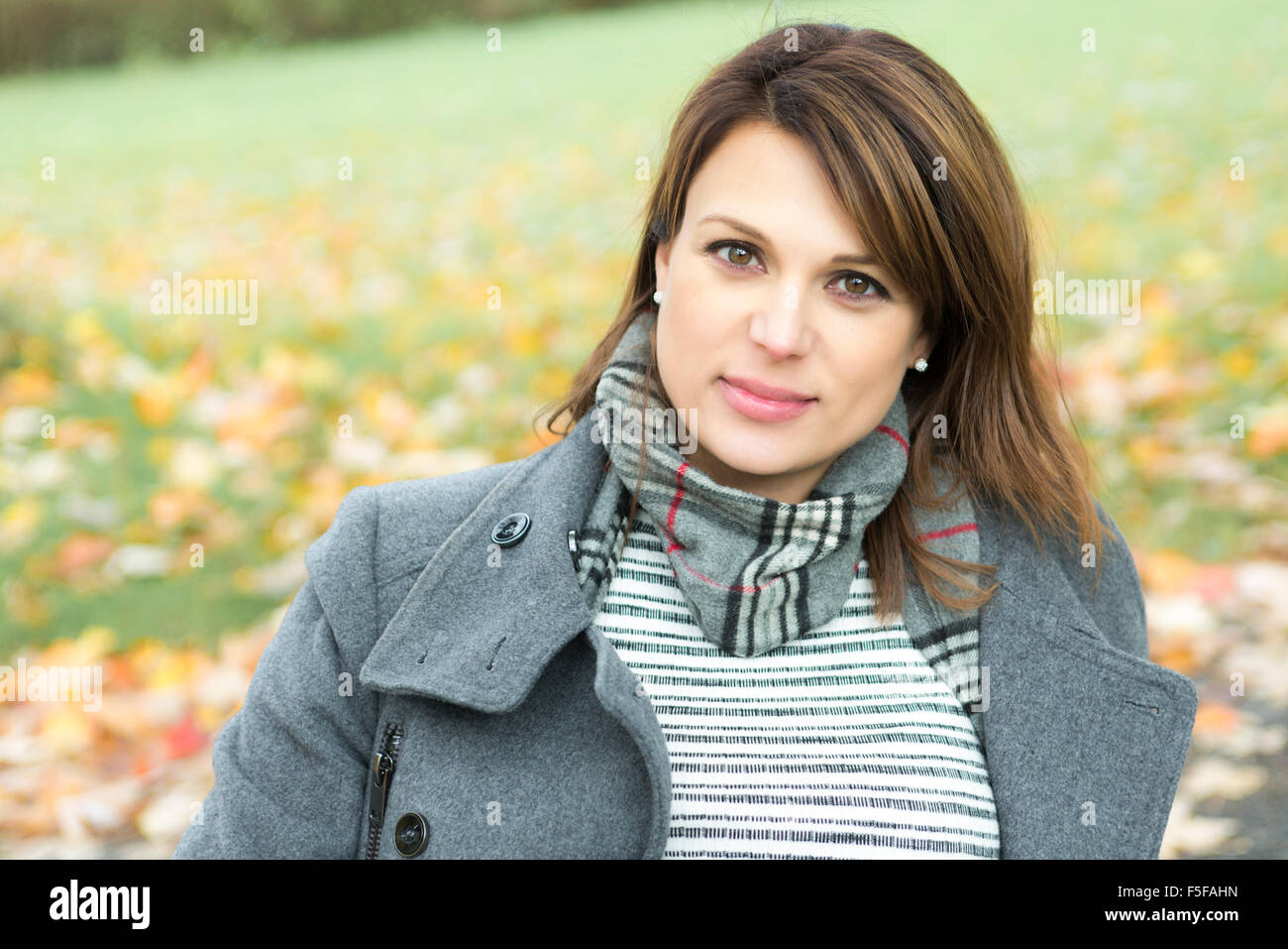 Beautiful pregnant woman in the autumn park Stock Photo - Alamy