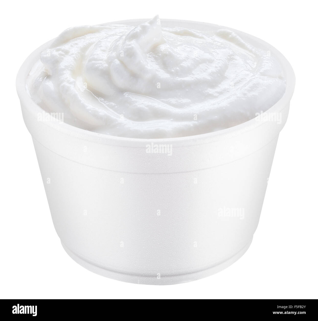 Sour cream in the polystyrene cup. File contains clipping paths. Stock Photo