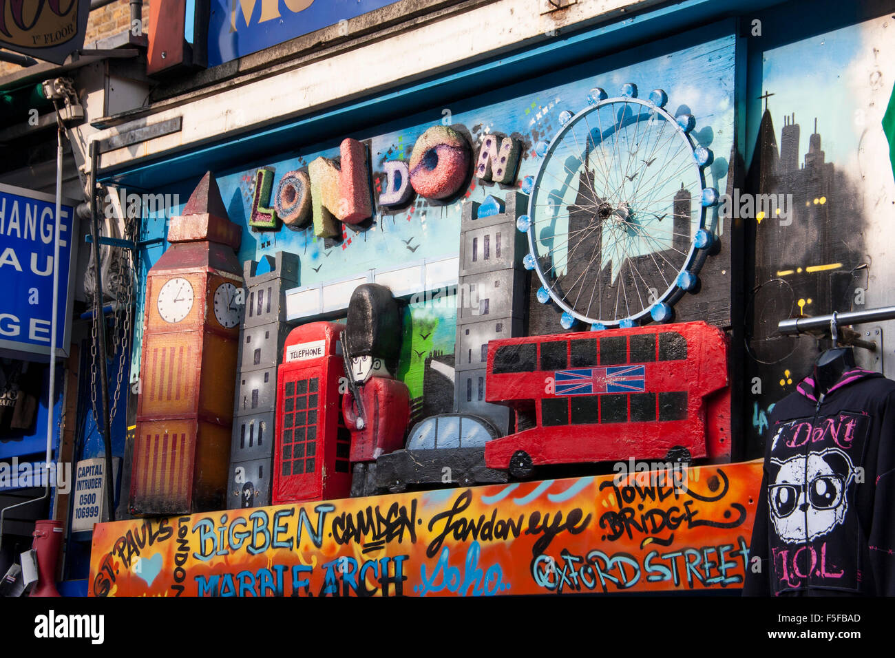 London icons Big Ben London Eye Tower Bridge Guards police taxis red buses etc on shop front Camden London England UK Stock Photo
