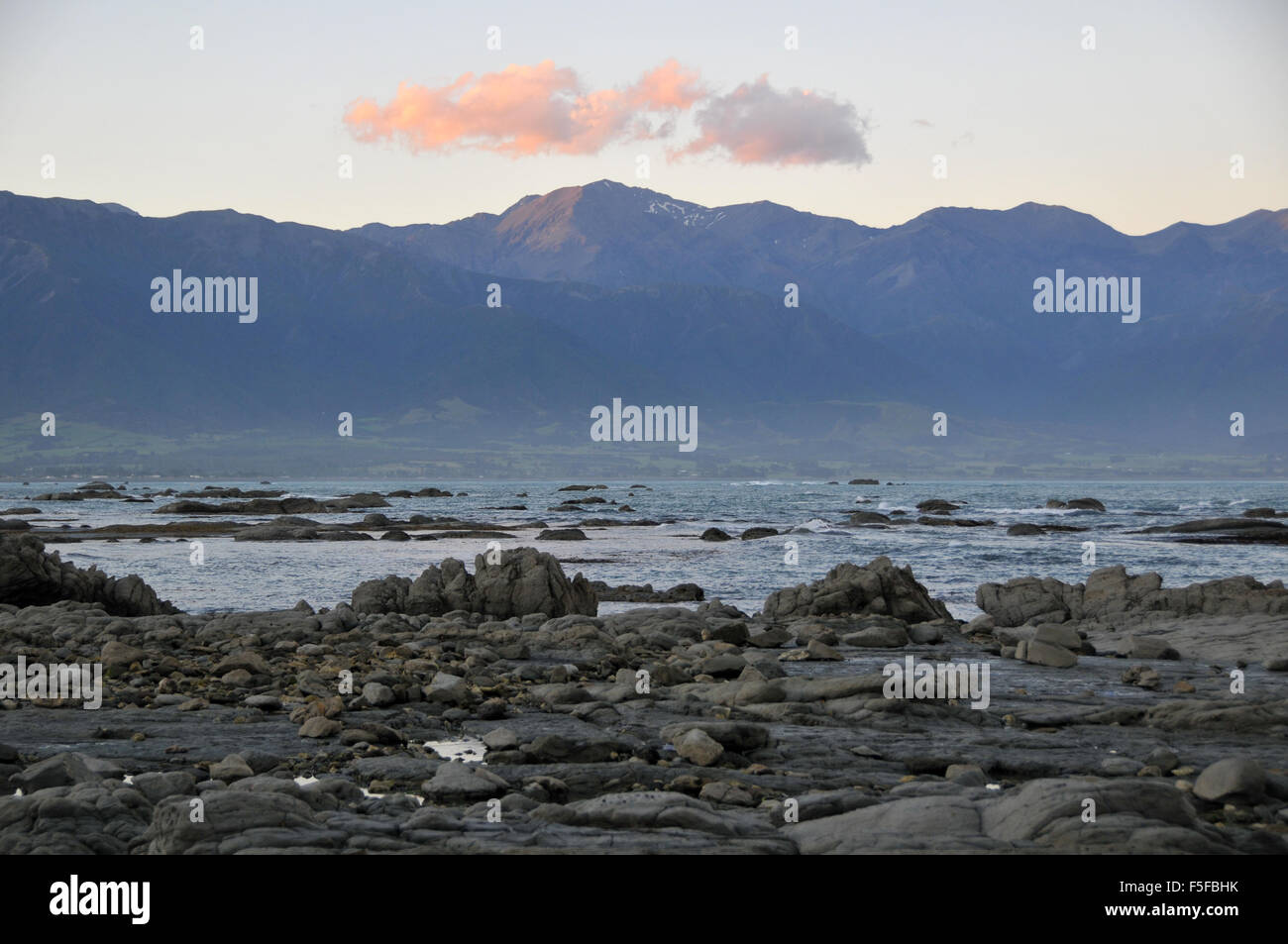 Rocks and tide pools of the Kaikoura Peninsula, Kaikoura, South Island, New Zealand Stock Photo