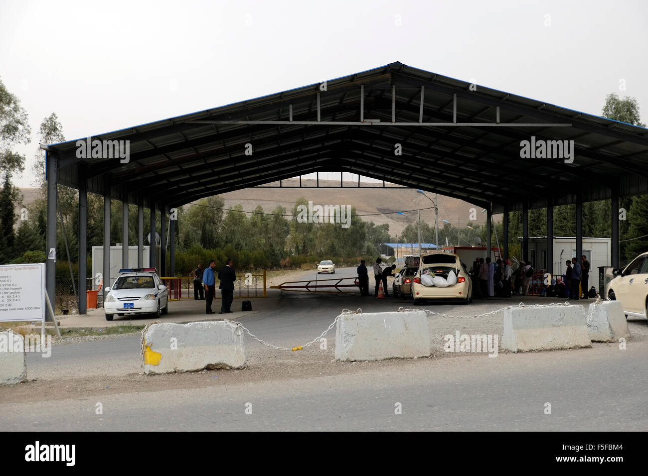 The entrance to the Iraqi side of Faysh Khabur or Fishkhabur -Semalka border crossing across the Tigris river which divide between northern Iraq and Rojava the de facto Kurdish autonomous region originating in and consisting of three self-governing cantons in northern Syria Stock Photo