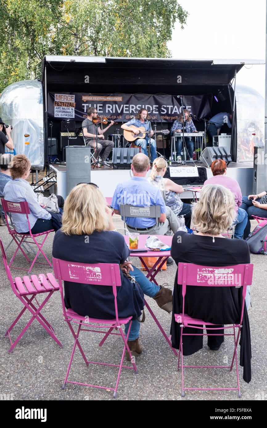 Rear view of people enjoying music at the riverside stage  south bank london Stock Photo
