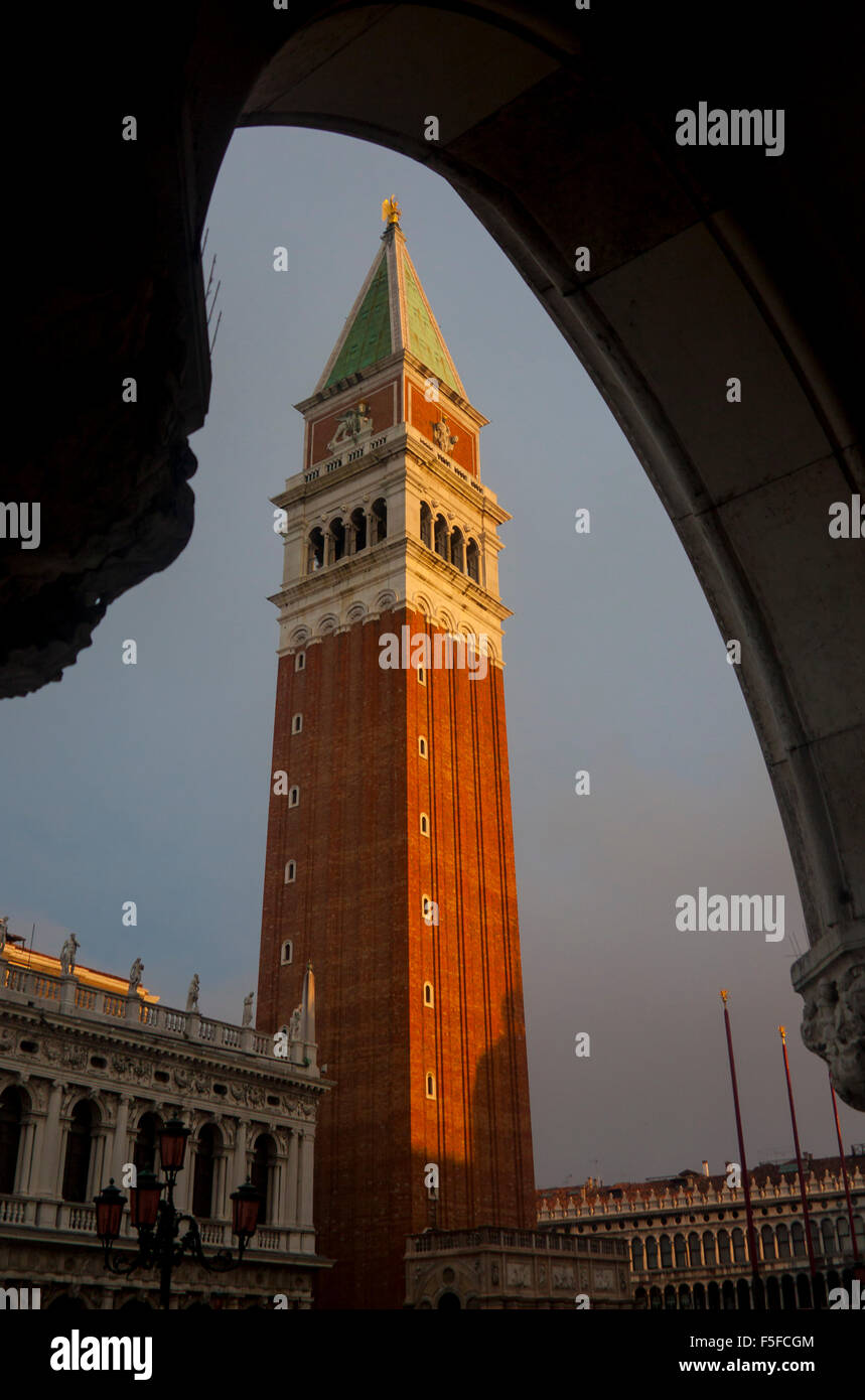 Campanile of St Mark's San Marco Basilica seen through arch of Palazzo Ducale Doge's Palace at dawn Venice Veneto Italy Stock Photo