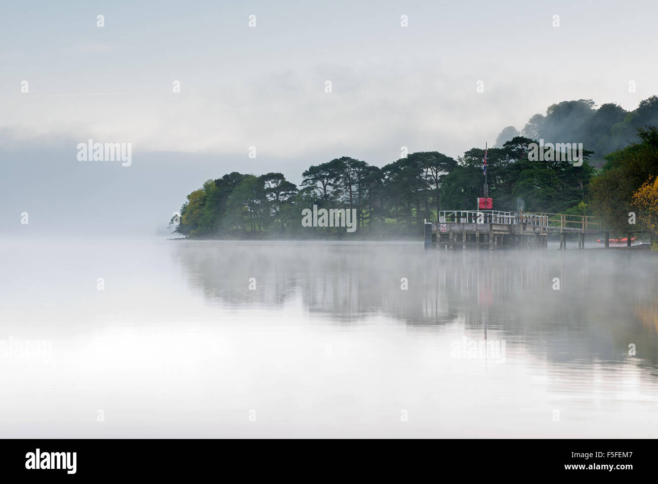 Howtown pier at dawn during mist, Ullswater, Lake District, Cumbria, England,  UK, GB. Stock Photo