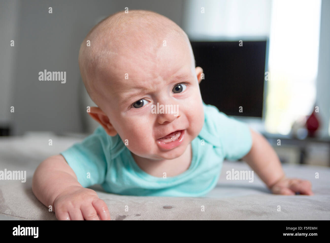 Baby laying on tummy hires stock photography and images Alamy
