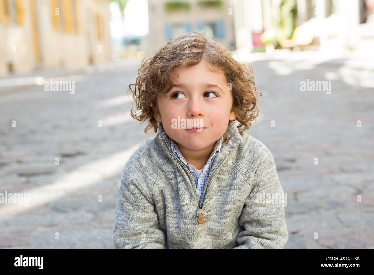 portrait of a boy on a urban background Stock Photo - Alamy