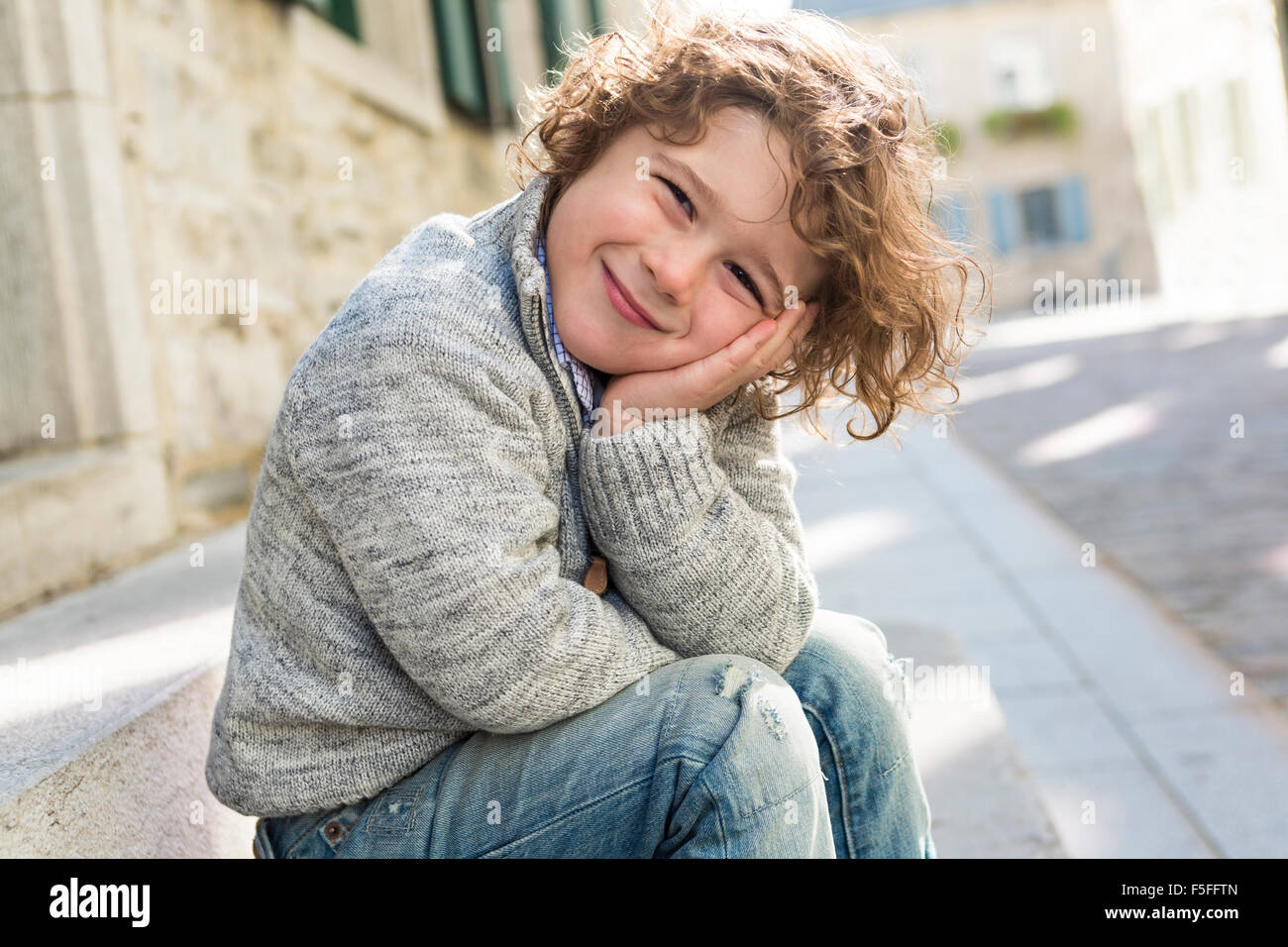 portrait of a boy on a urban background Stock Photo - Alamy
