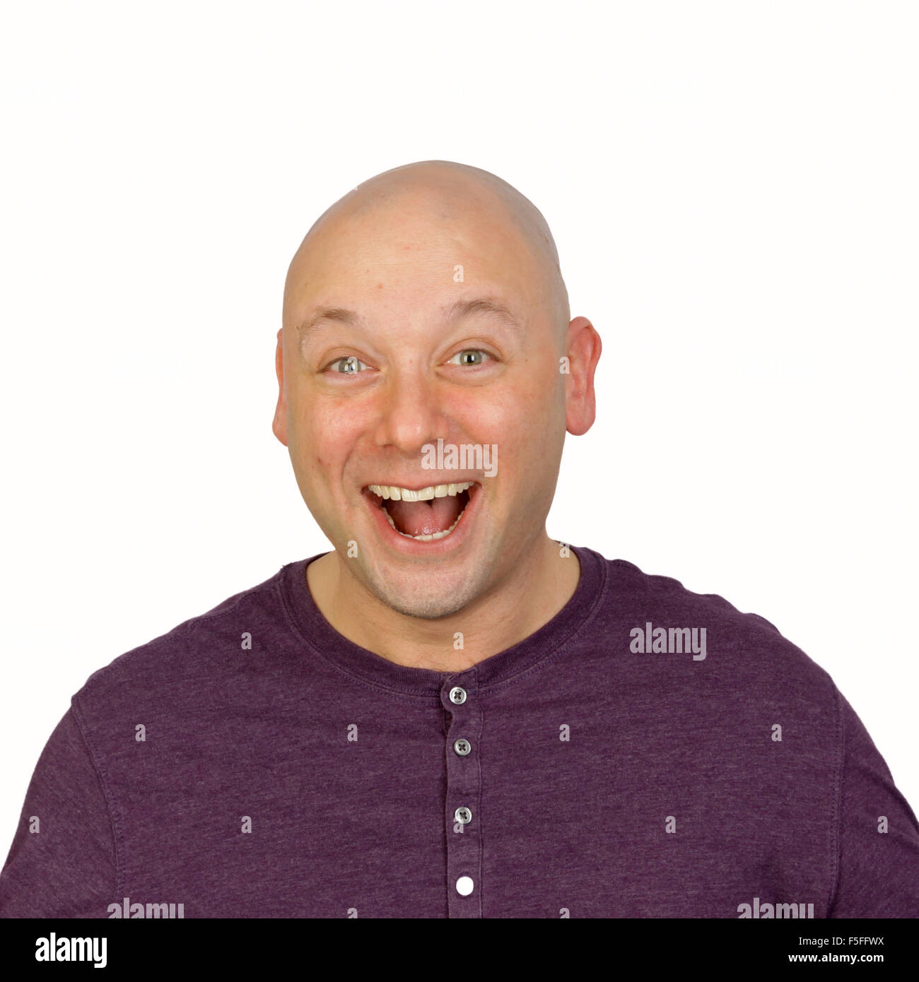 Guffaw facial expression on man's face shot in studio white background Stock Photo