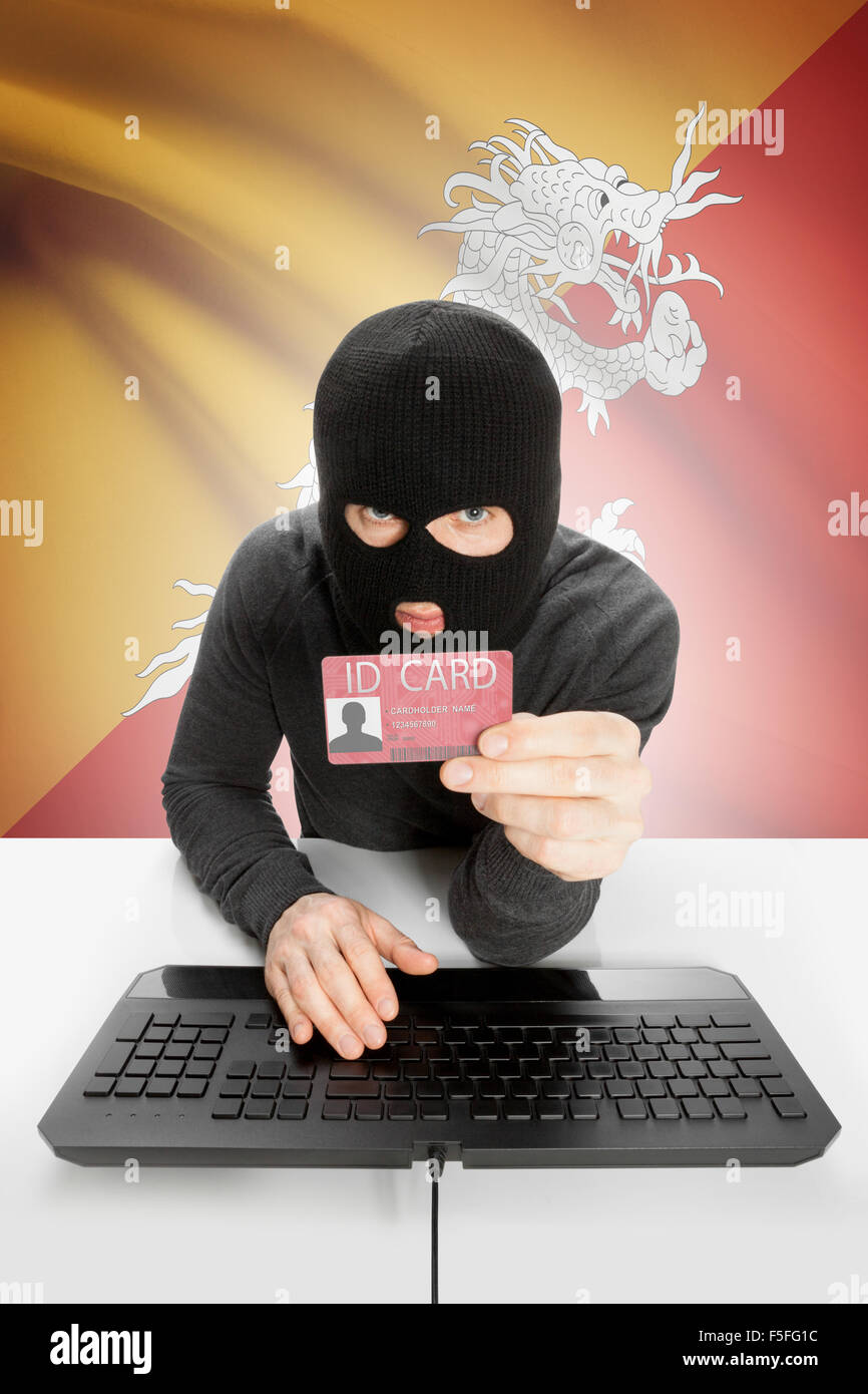 Hacker with ID card in hand and flag on background Bhutan Stock Photo