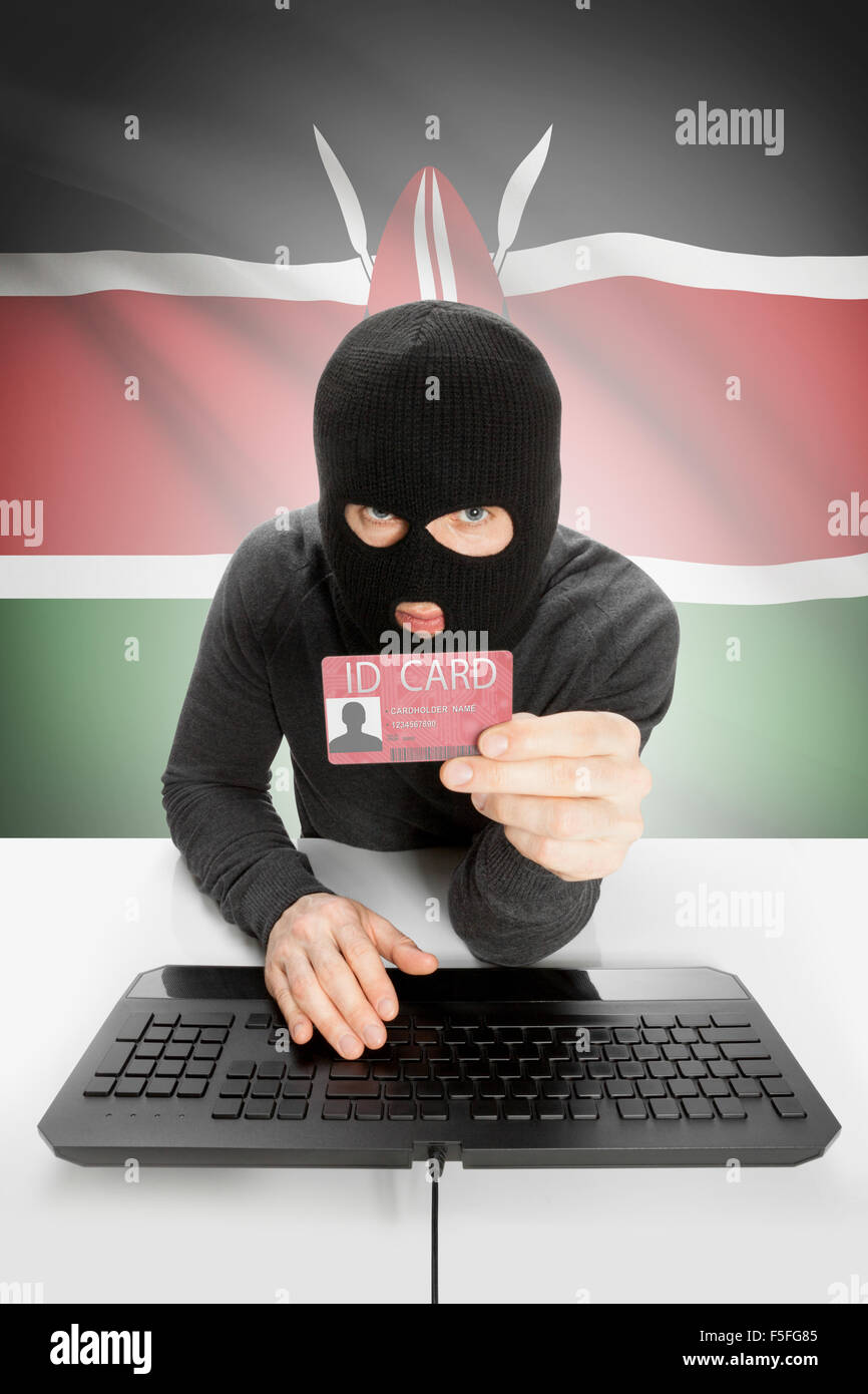 Hacker with ID card in hand and flag on background - Kenya Stock Photo