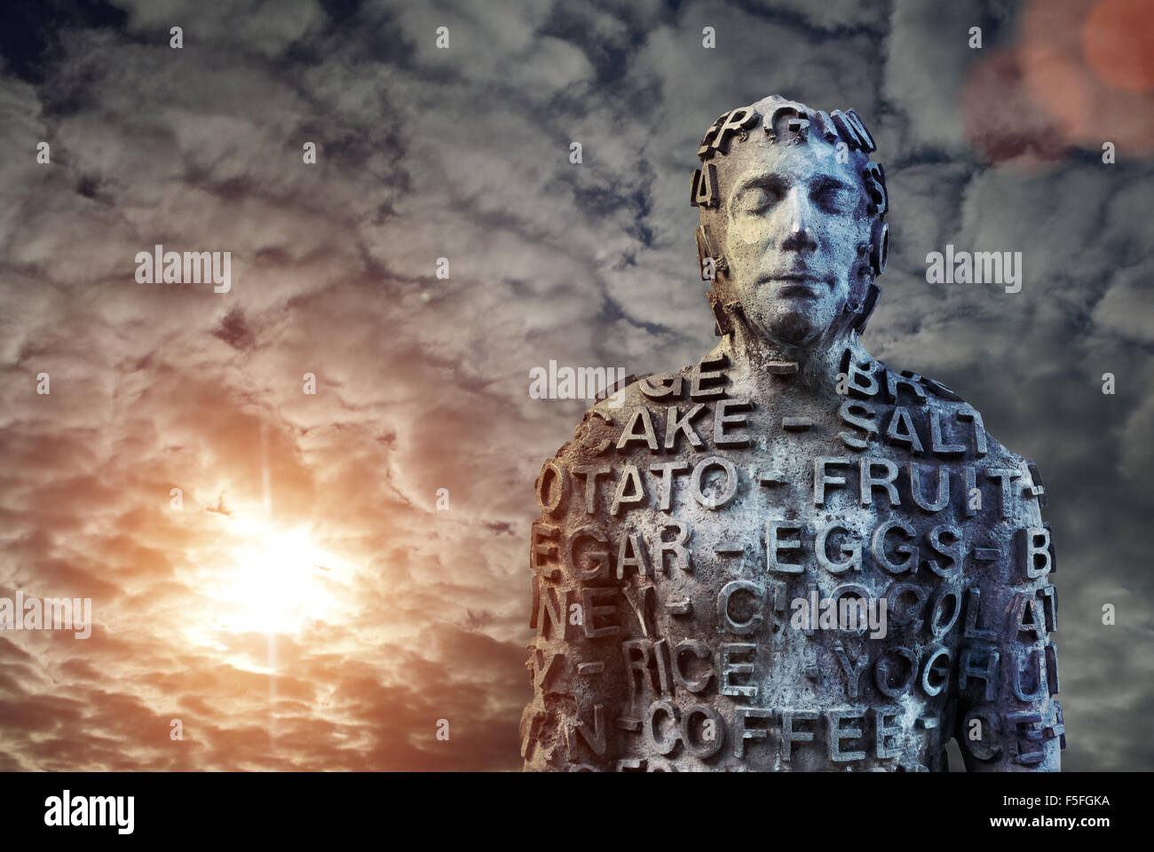 Metal human statue covered with letters Stock Photo Alamy