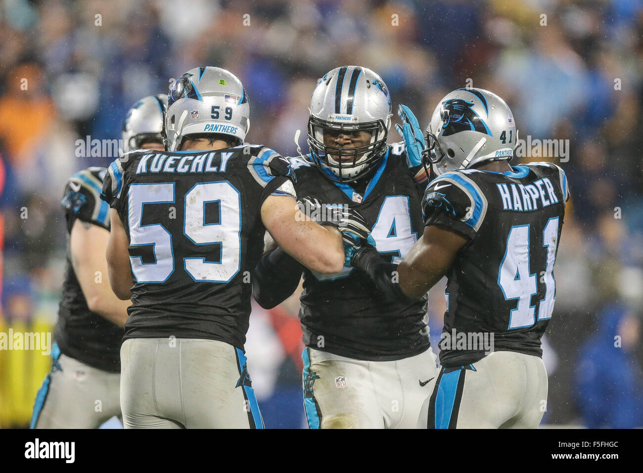Overtime. 2nd Nov, 2015. NC, Carolina Panthers middle linebacker Luke Kuechly #59 and Carolina Panthers strong safety Roman Harper #41 congratulate Carolina Panthers defensive end Kony Ealy #94 after he knocked the ball from the hands of Indianapolis Colts quarterback Andrew Luck #12 on November 2, 2015, at Bank of America in Charlotte, North Carolina. The Panthers defeated the Colts 29-26 in overtime.Margaret Bowles/CSM/Alamy Live News Stock Photo