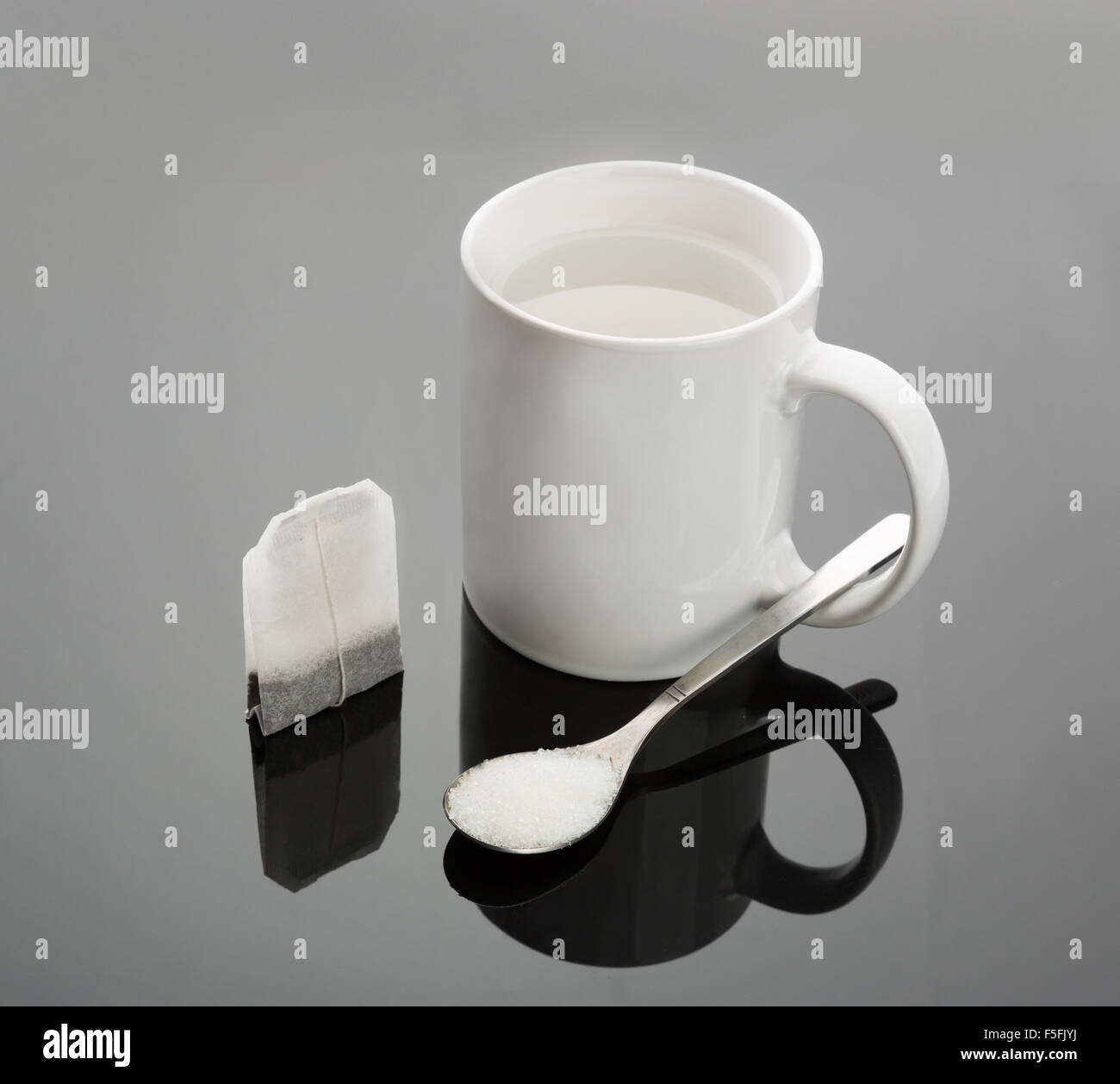 Cup, spoon and tea bag Stock Photo Alamy