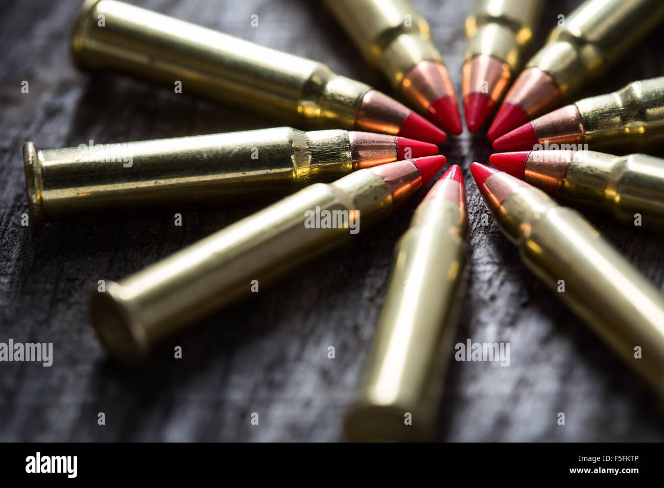 Macro shot of small-caliber tracer rounds with a red tip Stock Photo ...