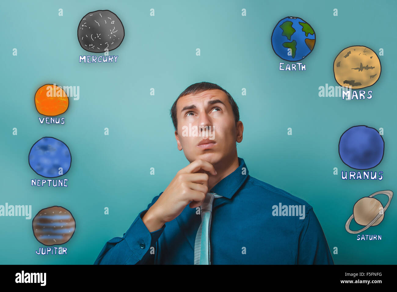 businessman man holds his chin thinking planets of the solar sys Stock Photo