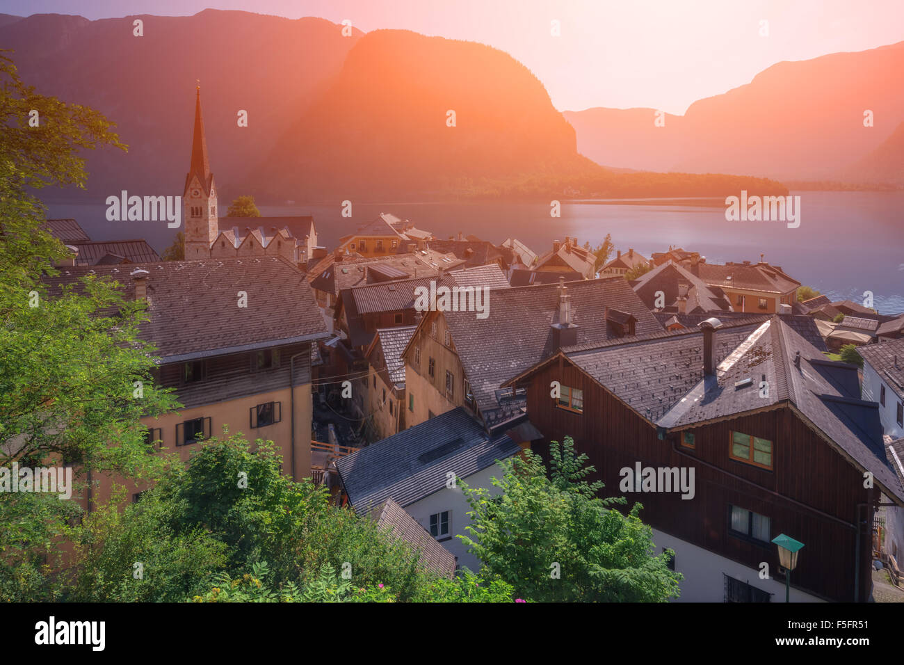 Sunny summer day in the Hallstatt village in the Austrian Alps. Maria am Berg church and Hallstattersee lake, Austria, Europe. Stock Photo